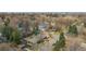 Aerial view of a neighborhood featuring mature trees and well maintained homes near a busy city at 456 Cherry St, Denver, CO 80220
