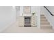 Basement bar area with sink, mini fridge and stairs to the upper floor at 456 Cherry St, Denver, CO 80220