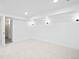 Unfurnished basement features all-white walls and new carpet flooring at 456 Cherry St, Denver, CO 80220