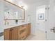 Bright bathroom with double sinks, hardwood cabinetry, and modern fixtures at 456 Cherry St, Denver, CO 80220