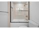 Bright, tiled bathroom features glass door, sleek fixtures and hardware at 456 Cherry St, Denver, CO 80220