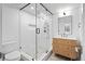 Modern bathroom showcasing tiled shower with glass door, sleek vanity, and stylish fixtures with neutral colors at 456 Cherry St, Denver, CO 80220