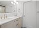 Bathroom features double sinks with white countertops, light wood cabinetry, and modern fixtures at 456 Cherry St, Denver, CO 80220