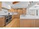 Updated kitchen with white countertops, stainless steel appliances, and sleek wood cabinetry at 456 Cherry St, Denver, CO 80220