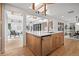 Open concept kitchen with stainless steel dishwasher and center island with sink and seating at 456 Cherry St, Denver, CO 80220