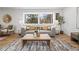 Cozy living room with natural light, modern sofa, and wooden coffee table at 456 Cherry St, Denver, CO 80220