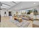 Bright living room with a large window, light hardwood floors, and stylish decor at 456 Cherry St, Denver, CO 80220