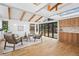 Bright living room with wooden beamed ceilings and oversized glass doors to the outdoor space at 456 Cherry St, Denver, CO 80220