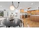 Open concept layout with a dining area, living room, and updated kitchen at 456 Cherry St, Denver, CO 80220
