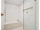 Bright shower features elegant tilework, bench seating, and convenient inset shelving at 456 Cherry St, Denver, CO 80220