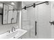 This modern bathroom features a glass-enclosed shower, vanity and new fixtures, blending style and functionality at 592 Brook Dr, Idaho Springs, CO 80452