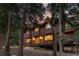 Beautiful wood home nestled among tall trees, creating a serene and private mountain retreat at 592 Brook Dr, Idaho Springs, CO 80452