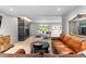 Cozy living room with a modern fireplace, comfortable leather seating, and stylish decor at 592 Brook Dr, Idaho Springs, CO 80452