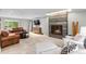 Comfortable living room with a modern fireplace, plush seating, and elegant decor at 592 Brook Dr, Idaho Springs, CO 80452