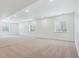Spacious finished basement with carpet and three windows for natural light at 8607 Yellowcress St, Littleton, CO 80125