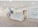 Finished basement area with a bar area with cabinets and staircase at 8607 Yellowcress St, Littleton, CO 80125