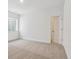 Bedroom with carpet, one window and an open door that leads to a closet at 8607 Yellowcress St, Littleton, CO 80125