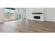 Spacious living room with wood floors, fireplace, and natural light at 8607 Yellowcress St, Littleton, CO 80125