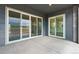 This covered patio features sliding glass doors providing seamless indoor-outdoor living and natural light at 8607 Yellowcress St, Littleton, CO 80125