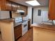 Efficient kitchen with white appliances and functional counter space at 8335 Fairmount Dr # 8-206, Denver, CO 80247