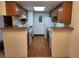 Efficient kitchen with white appliances and practical layout at 8335 Fairmount Dr # 8-206, Denver, CO 80247
