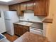 Well-appointed kitchen with white appliances and ample storage at 8335 Fairmount Dr # 8-206, Denver, CO 80247