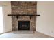 Inviting living room featuring a striking stone fireplace at 8335 Fairmount Dr # 8-206, Denver, CO 80247