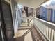 Outdoor balcony with white wooden railing and views of the complex at 8335 Fairmount Dr # 8-206, Denver, CO 80247