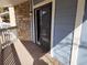 The private deck is carpeted and has gray wood plank siding at 8335 Fairmount Dr # 8-206, Denver, CO 80247