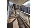 Balcony patio with white wooden railing, carpeted floors, and shade at 8335 Fairmount Dr # 8-206, Denver, CO 80247