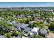 Aerial view of a neighborhood with lush trees, showcasing the home's desirable location at 1065 S Monroe St, Denver, CO 80209