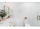 Modern bathroom with marble tile, glass shower, and elegant fixtures at 1065 S Monroe St, Denver, CO 80209