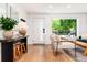 Inviting foyer with hardwood floors, console table, and large window at 1065 S Monroe St, Denver, CO 80209