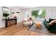 Cozy living room with hardwood floors and lots of natural light at 1065 S Monroe St, Denver, CO 80209