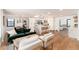 Open-concept living and dining area with hardwood floors and modern finishes at 1065 S Monroe St, Denver, CO 80209