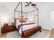 Elegant main bedroom with a canopy bed, soft lighting, and a view of the walk-in closet at 1065 S Monroe St, Denver, CO 80209