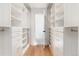 Organized walk-in closet with custom shelving and storage drawers at 1065 S Monroe St, Denver, CO 80209