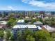 Scenic aerial view of the city buildings with mountain views, a perfect urban oasis at 555 E 10Th Ave # 111, Denver, CO 80203