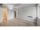 Bedroom features a large window, wood floors and closet at 555 E 10Th Ave # 111, Denver, CO 80203