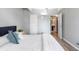 Bedroom featuring ensuite bathroom access and ample closet space at 555 E 10Th Ave # 111, Denver, CO 80203