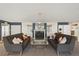 Cozy common area with two sofas, fireplace, and mirrored built-ins at 555 E 10Th Ave # 111, Denver, CO 80203