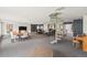Bright common area with spiral staircase, dining, seating, and piano at 555 E 10Th Ave # 111, Denver, CO 80203