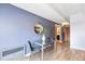 Cozy dining area with wood floors, stylish table, and a view into the hallway at 555 E 10Th Ave # 111, Denver, CO 80203