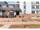 Well-maintained condominium building with brick accents and manicured landscaping at 555 E 10Th Ave # 111, Denver, CO 80203