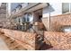 Charming condo entrance featuring brick accents and well-maintained landscaping, perfect for a welcoming arrival at 555 E 10Th Ave # 111, Denver, CO 80203