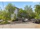 Apartment building surrounded by lush greenery at 555 E 10Th Ave # 111, Denver, CO 80203