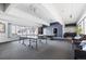 Bright community game room with a ping pong table, pool table and comfortable seating areas at 555 E 10Th Ave # 111, Denver, CO 80203