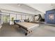 Entertaining game room featuring a pool table, ping pong table, lounge seating, and lots of space for activities at 555 E 10Th Ave # 111, Denver, CO 80203