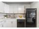 Kitchen features stainless steel appliances, white countertops, and designer backsplash at 555 E 10Th Ave # 111, Denver, CO 80203