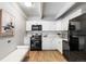 Modern kitchen with white cabinets and stainless steel appliances at 555 E 10Th Ave # 111, Denver, CO 80203